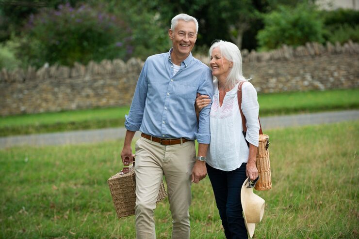 adorable-senior-couple-being-affectionate-while-taking-walk