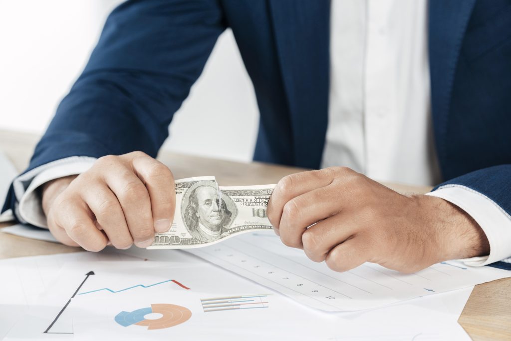 close-up-hands-holding-banknote