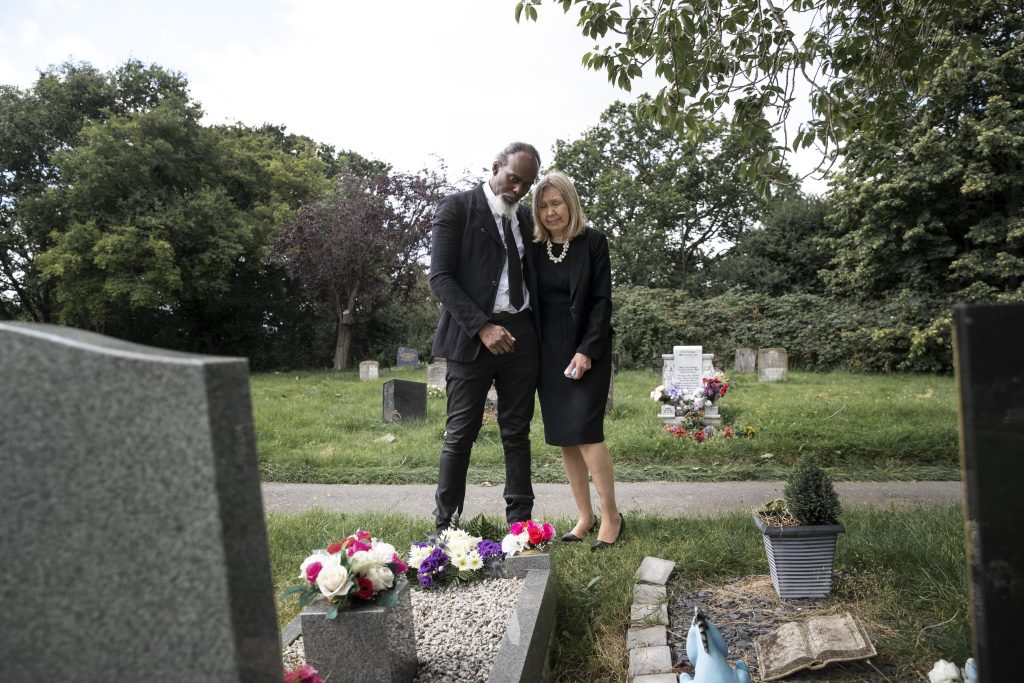 family-visiting-grave-loved-one