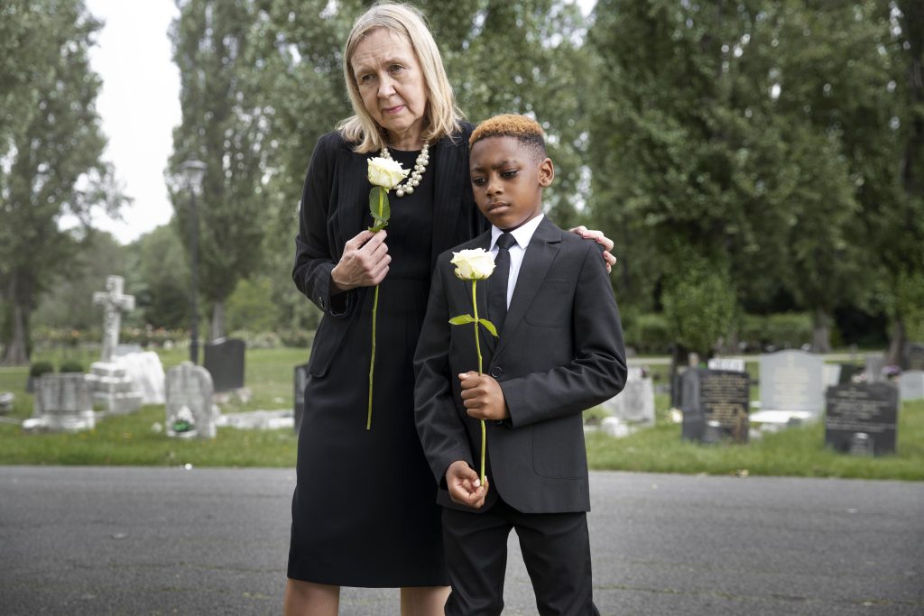 family-visiting-grave-loved-one