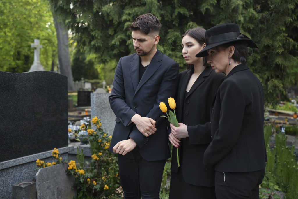 mourning-family-together-cemetery