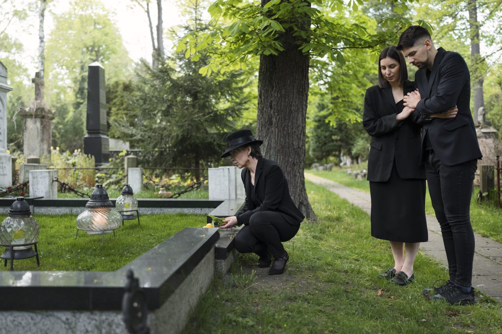 mourning-family-together-cemetery