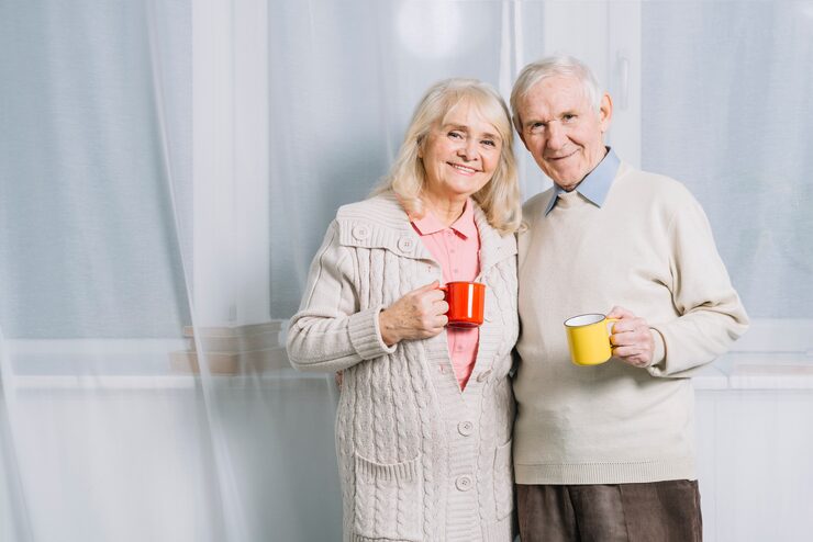 senior-couple-with-mugs-coffee